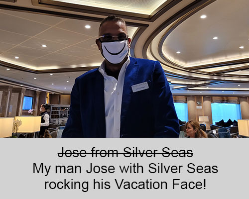 Jose wearing a face mask that has a smile and says this is my vacation face